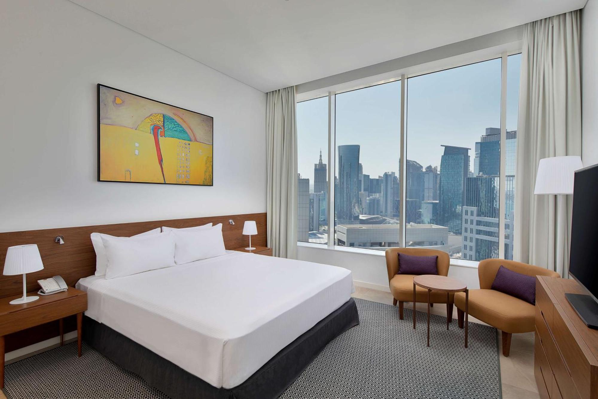 Aleph Doha Residences, Curio Collection By Hilton Экстерьер фото A bedroom at the hotel