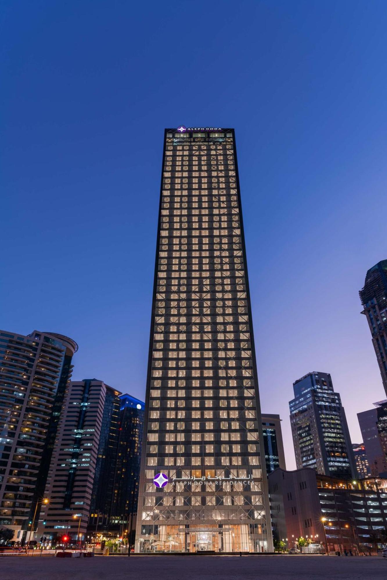 Aleph Doha Residences, Curio Collection By Hilton Экстерьер фото The building at night