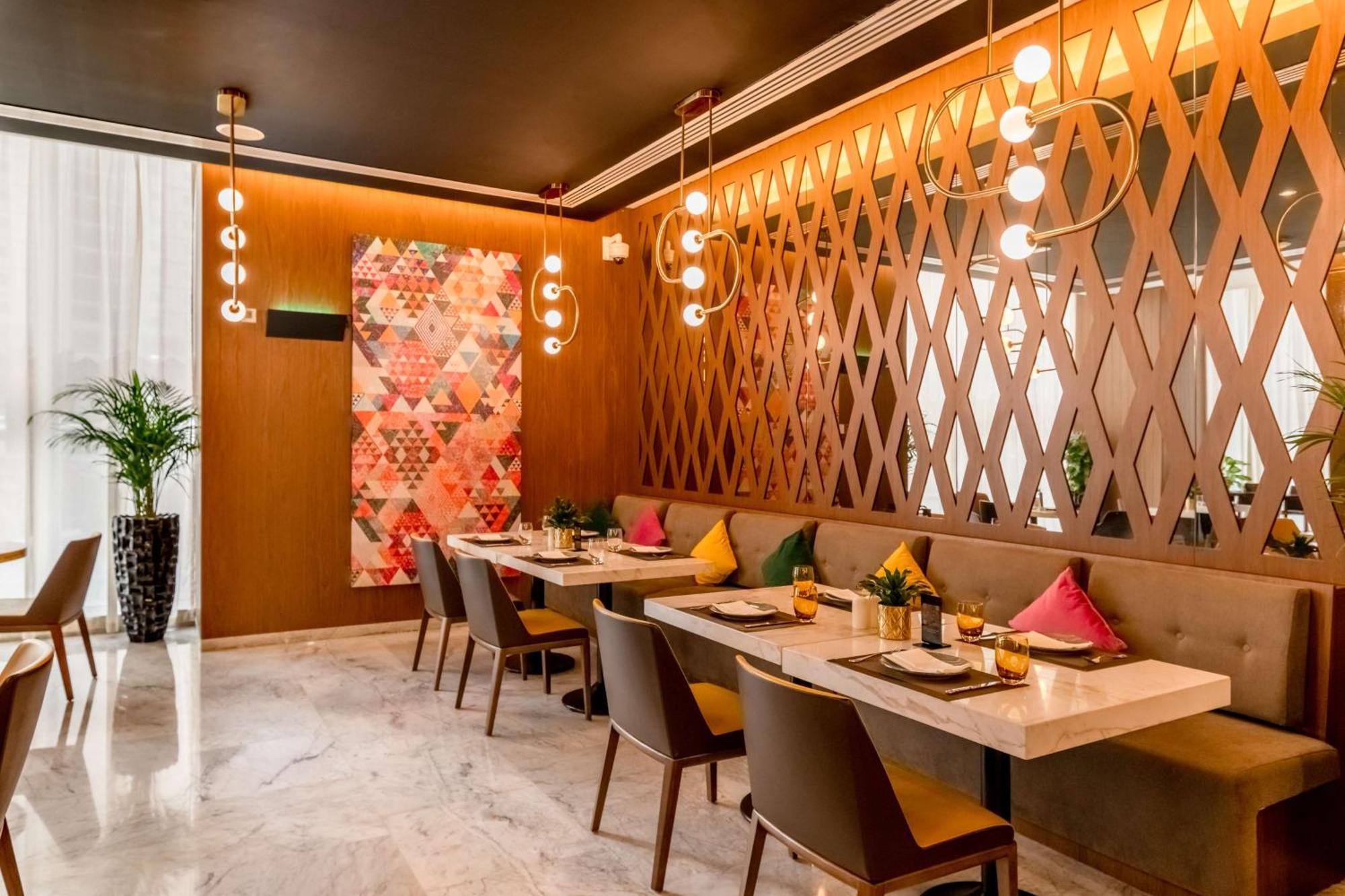 Aleph Doha Residences, Curio Collection By Hilton Экстерьер фото The interior of the restaurant